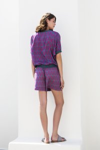 Geometric pattern sleeved top with knitted details petrol-orchid flower